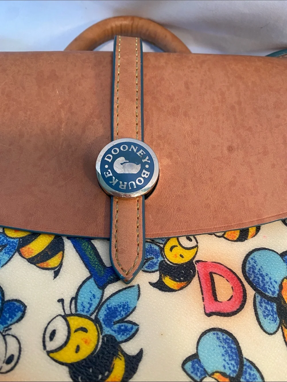 Dooney & Bourke Bee Print Satchel in Tan and Cream with Blue & Yellow Accents